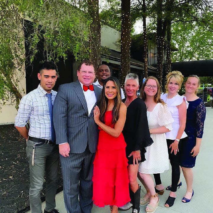 Staff members from The Insurance Source gather with the company's owner, Guy Furay, and his wife, Myra Ruiz. From left, Eric Inafuku; Furay and Ruiz; Rodney Evans; Tami Baber; Kristina Williams; Wendy Bellert; and Karis McGuire.