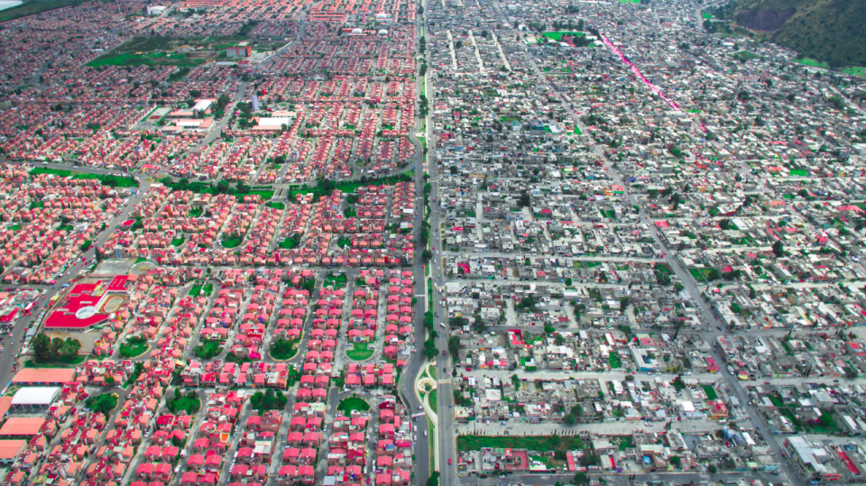 <p>Swathes of colour on the richest side in Mexico City, are a stark contrast to the blandness on the poorest side (MediaDrumWorld/Johnny Miller) </p>