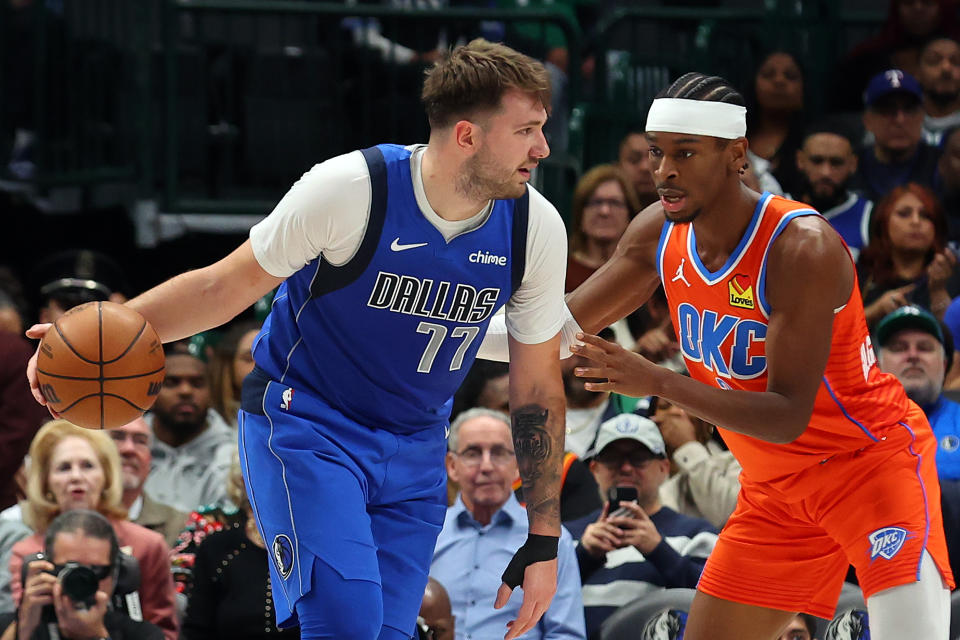 DALLAS, TEXAS - DECEMBER 02: Luka Doncic #77 of the Dallas Mavericks looks for an opening against Shai Gilgeous-Alexander #2 of the Oklahoma City Thunder at American Airlines Center on December 02, 2023 in Dallas, Texas. NOTE TO USER: User expressly acknowledges and agrees that, by downloading and or using this photograph, User is consenting to the terms and conditions of the Getty Images License Agreement. (Photo by Richard Rodriguez/Getty Images)