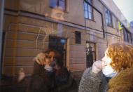 A detained protestor looks on from inside a police van during a protest in support of jailed opposition leader Alexei Navalny in St. Petersburg, Russia, Wednesday, April 21, 2021. A human rights group that monitors political repressions said at least 400 people were arrested across the country in connection with the protests. Many were seized before protests even began, including two top Navalny associates in Moscow. (AP Photo/Dmitri Lovetsky)