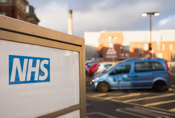 Newcastle, UK - February 10, 2016: The NHS (National Health Service) logo on an entrance sign for the Royal Victoria Infirmary, a teaching hospital which includes an accident and emergency department.