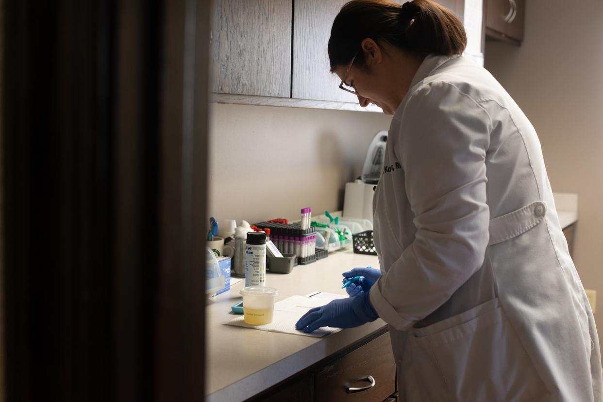 Oasis Family Health Medicine, registered nurse Renea Koster works on lab testing last week at the health clinic. Patients are entitled to unlimited visits and discounted pricing for special labs and procedures through the membership model.