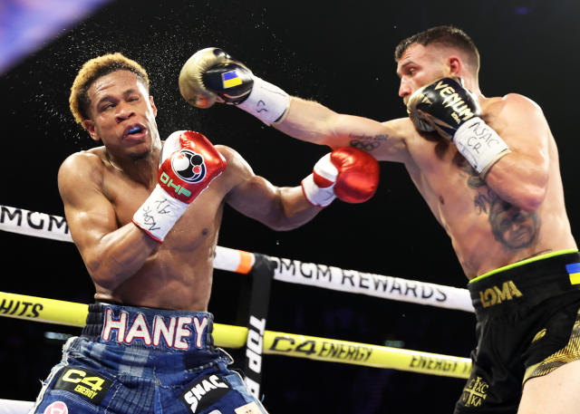 LAS VEGAS, NEVADA - MAY 20: Devin Haney (L) and Vasiliy Lomachenko (R) exchange punches during their Undisputed lightweight championship fight at MGM Grand Hotel & Casino on May 20, 2023 in Las Vegas, Nevada. (Photo by Mikey Williams/Top Rank Inc via Getty Images)