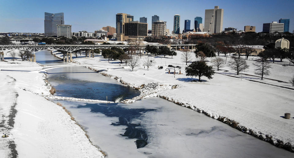 The Trinity River is mostly frozen after a snow storm Monday, Sept. 15, 2021, in Fort Worth, Texas. A frigid blast of winter weather across the U.S.  has left more than 2 million people in Texas without power. (Yffy Yossifor/Star-Telegram via AP)