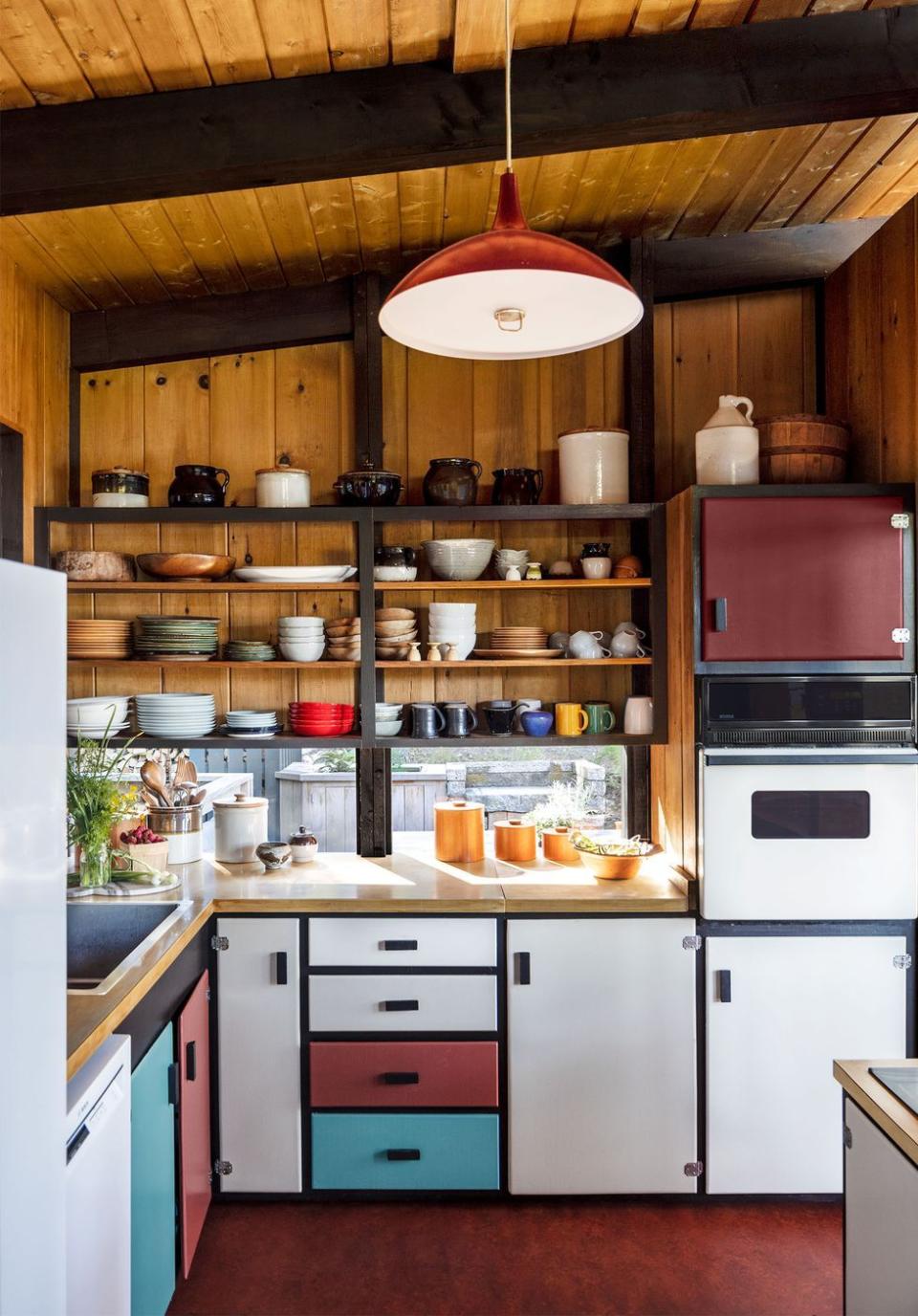 a kitchen with a shelf and cabinets