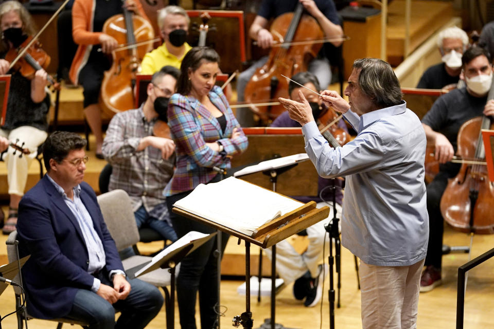 Italian conductor Riccardo Muti, 80, right, baritone Luca Salsi, left, and soprano Joyce El-Khoury, center, rehearses Verdi's "Un Ballo in Maschera (A Masked Ball)" with the Chicago Symphony Orchestra in Chicago on Wednesday, June 22, 2022. Muti, whose Chicago contract runs through the 2022-23 season, considers himself the descendant of strong Italian conductors reaching back to Arturo Toscanini and Tulio Serafin. (AP Photo/Nam Y. Huh)