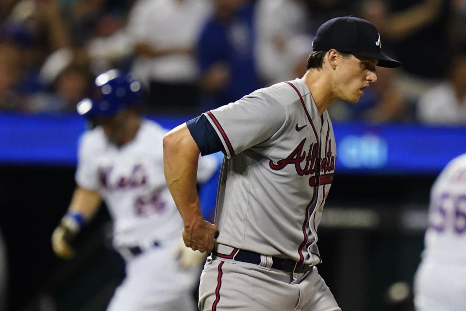 Atlanta Braves starting pitcher Kyle Wright waits as New York Mets' Tyler Naquin runs the bases after hitting a home run during the sixth inning of a baseball game Thursday, Aug. 4, 2022, in New York. (AP Photo/Frank Franklin II)