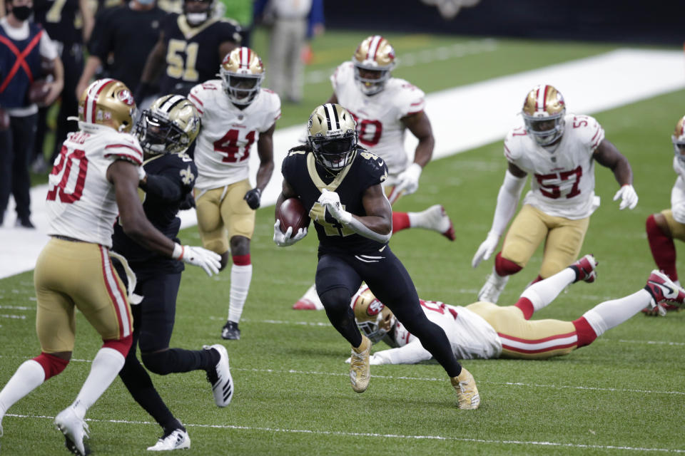 New Orleans Saints running back Alvin Kamara (41) carries on a 34 yard pass play in the first half of an NFL football game against the San Francisco 49ers in New Orleans, Sunday, Nov. 15, 2020. (AP Photo/Butch Dill)