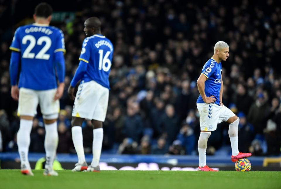 Players of Everton look downbeat after conceding the fourth goal (EPA)