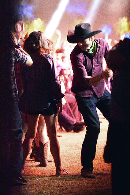 Ashton Kutcher and Mila Kunis love them some country music! The happy couple was spotted at the Stagecoach Country Music Festival in Indio, Calif. over the weekend, where Ashton clearly got into the spirit of the festival by rocking a Stetson cowboy hat, a bright green bandana and a huge belt buckle. Mila on the other hand, was more subtle in a blue denim shirt, a black Sunshine & Whiskey shirt, black shorts and her beloved Keds. Tying her hair up in a simple bun and rocking minimal makeup, Mila was still a stunner in her casual wear. Splash News PHOTOS: Sweetest Celebrity PDA The former <em>Two and a Half Men</em> star, 37, and the 31-year-old <em>Jupiter Ascending</em> actress also weren't afraid to let loose on the dance floor. Check them out adorably shaking it to Blake Shelton's "Footloose." Splash News And of course, they made time for some intense cuddling. Splash News Ashton and Mila are no strangers to Stagecoach, having attended last April when Mila was still pregnant with their now seven-month-old daughter Wyatt. NEWS: Did Mila Kunis Just Reveal She's Already Married to Ashton Kutcher? Perhaps the two needed a relaxing weekend after the bizarre stolen chicken lawsuit recently filed against Mila? Check out their amusing response to all the drama in the video below: