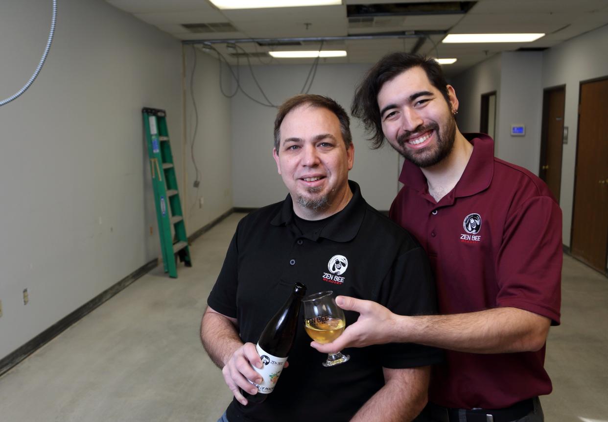 Dan DeMura (left), owner of Zen Bee Meadery, and his son, Yuuki, are pictured Jan. 11 at the new location of the meadery at 480 E. Wilson Bridge Road, Suite F, in Worthington. It is expected to open in February.