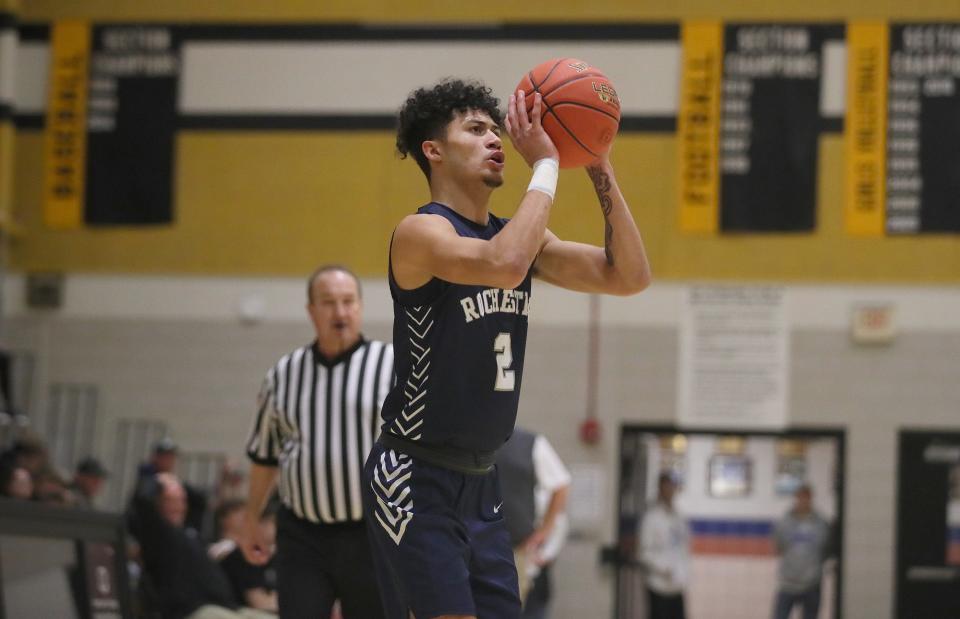 Rochester's Jerome Mullins shoots a three point shot during the second half against South Side Friday night at South Side High School.