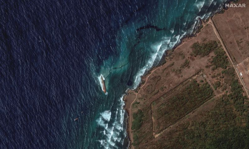 A satellite image shows an overview of a capsized barge and an oil spill, off the shore of Tobago Island
