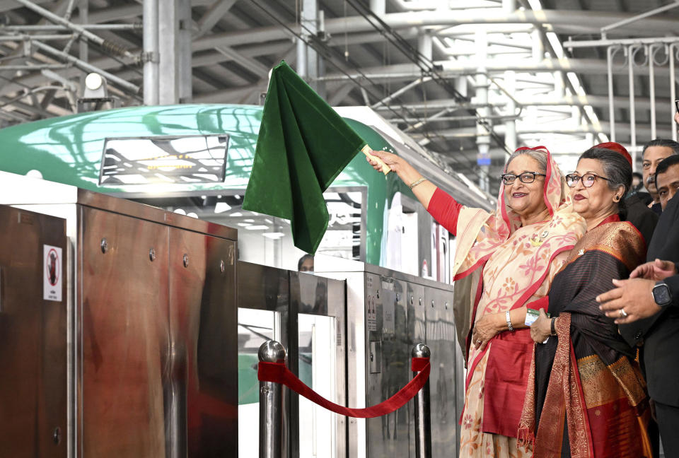 This handout photo provided by the Bangladesh Prime Minister's Office shows Prime Minister Sheikh Hasina inaugurate the country’s first metro rail service in Dhaka, Bangladesh, Wednesday, Dec, 28, 2022. Bangladesh launched its first metro rail service, mostly funded by Japan, in the densely populated capital on Wednesday amid enthusiasm that the South Asian country’s development bonanza would continue with both domestic and overseas funds. (Bangladesh Prime Minister's Office via AP)