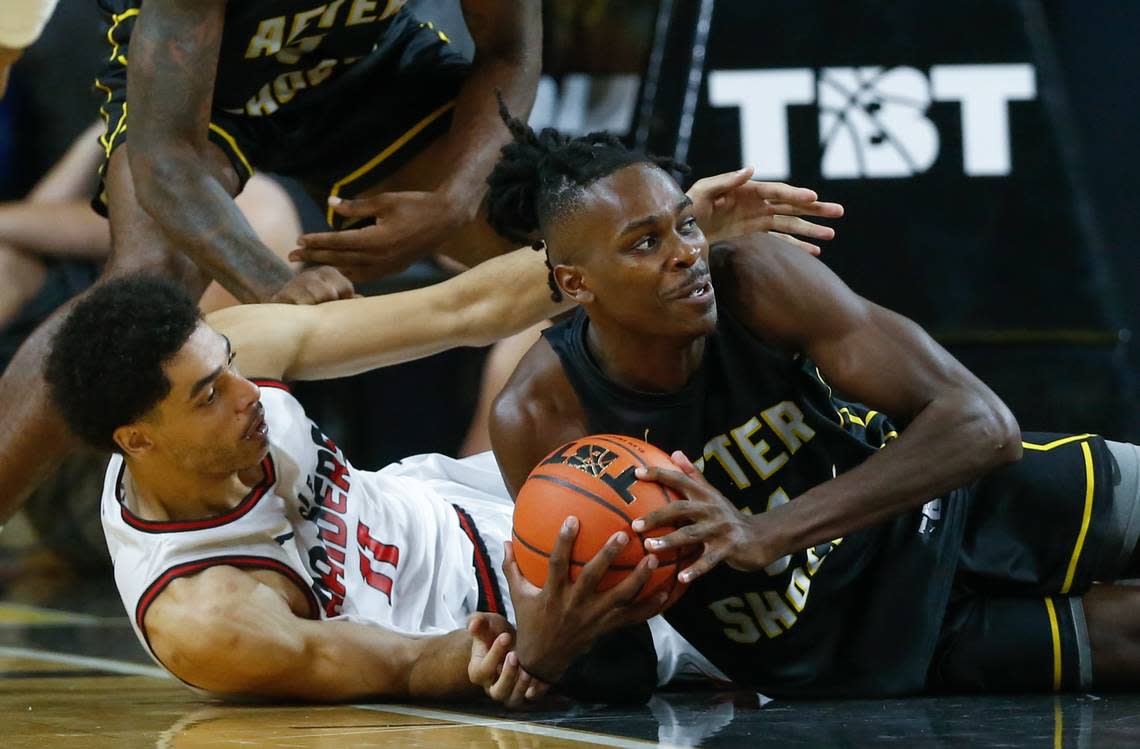 The Aftershocks’ James Dickey win the battle for a loose ball against the Air Raiders, a team of Texas Tech Alum, during the second round of The Basketball Tournament on Saturday night.