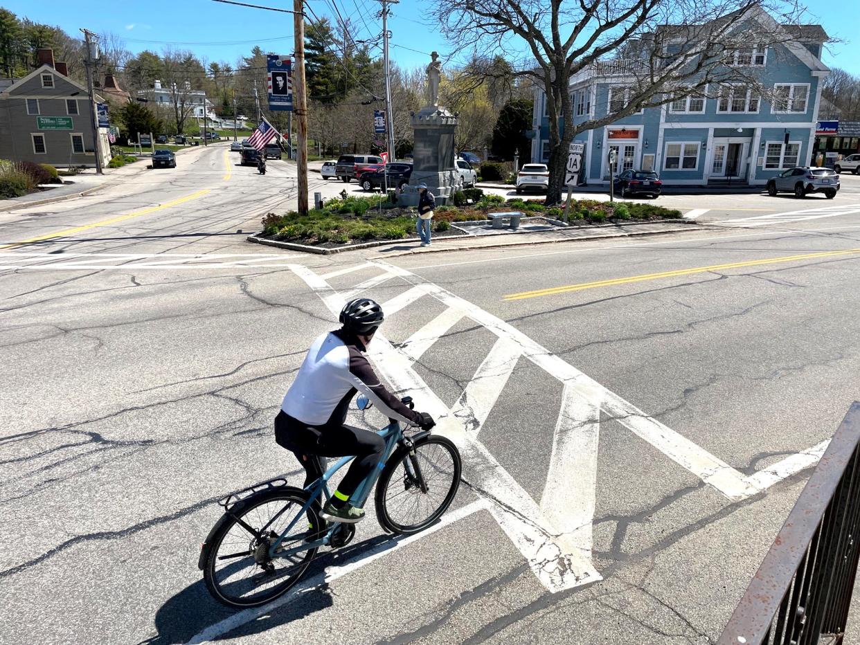 A cyclist rides in the downtown center of York on a beautiful Tuesday, May 7, 2024.