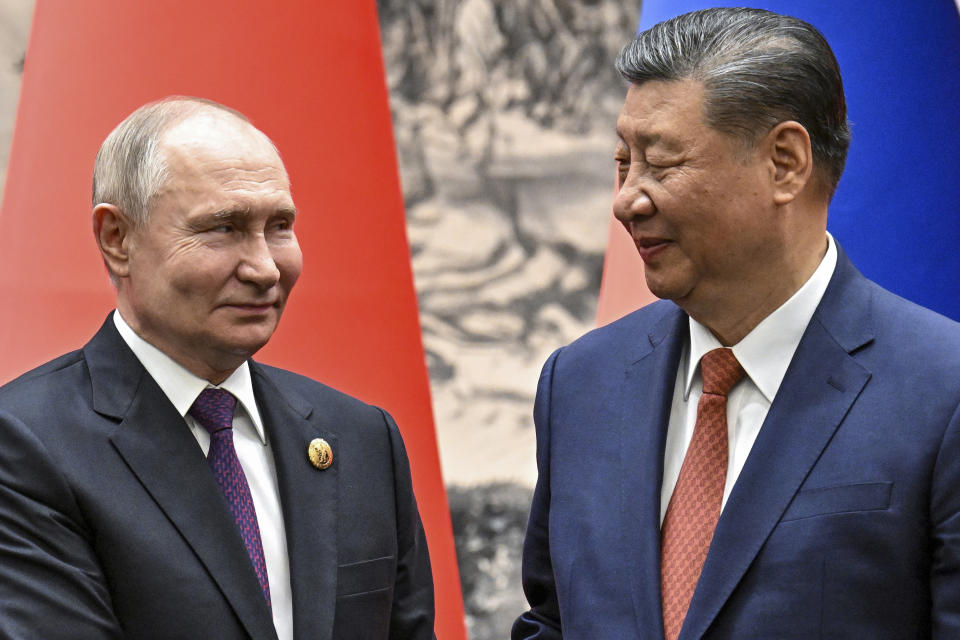 FILE - Chinese President Xi Jinping, right, and Russian President Vladimir Putin look toward each other as they shake hands prior to their talks in Beijing, China, Thursday, May 16, 2024. Putin and Xi will meet Thursday for the second time in as many months as they attend the Shanghai Cooperation Organization summit in Astana, Kazakhstan. (Sergei Bobylev, Sputnik, Kremlin Pool Photo via AP, File)