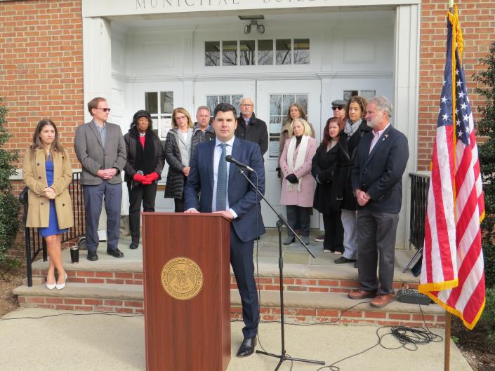 Morris Township Mayor Mark Gyorfy, center, speaks at a press conference at Morris Township Town Hall with several other Morris County mayors and elected officials to express concern about an approximate 20% increase in health insurance premiums for public employees