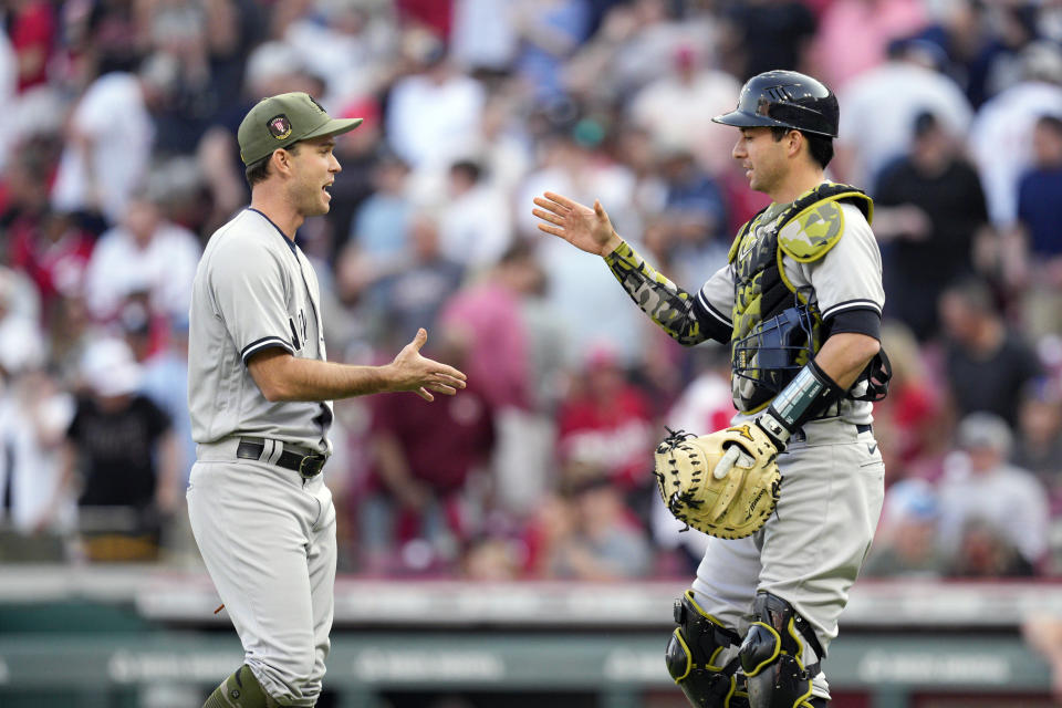 New York Yankees relief pitcher Ryan Weber, left, celebrates with catcher Ben Rortvedt following a baseball game against the Cincinnati Reds in Cincinnati, Saturday, May 20, 2023. (AP Photo/Jeff Dean)