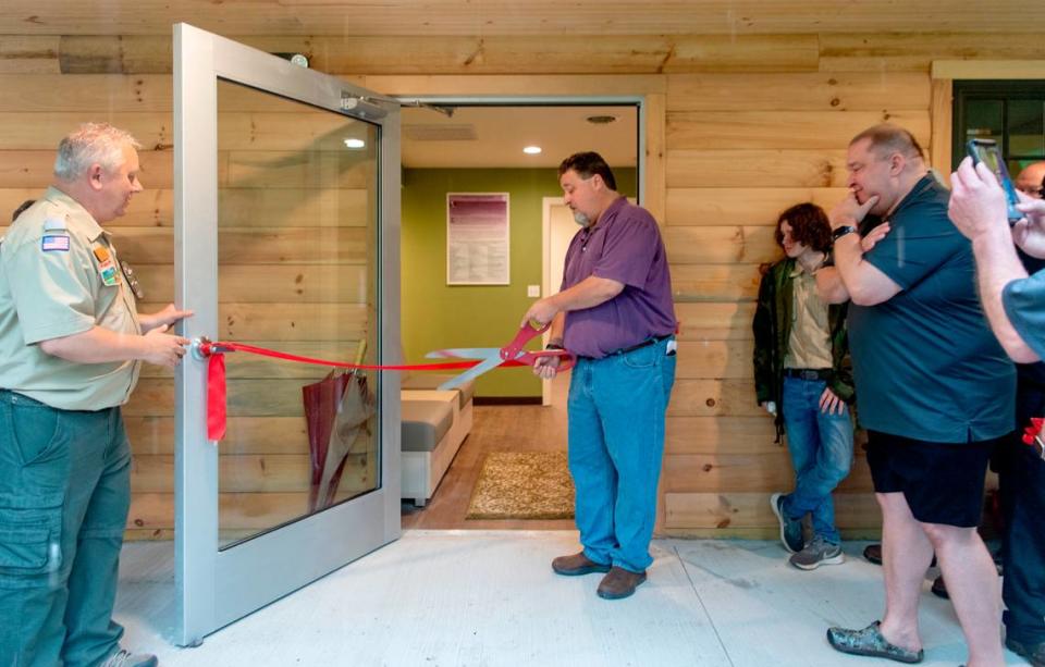 Don O’Connell cuts the ribbon for the David O’Connell Health Education Building at the Seven Mountains Scout Camp on Wednesday, June 22, 2022. The new facility will is to help the physical and mental health for the scouts.