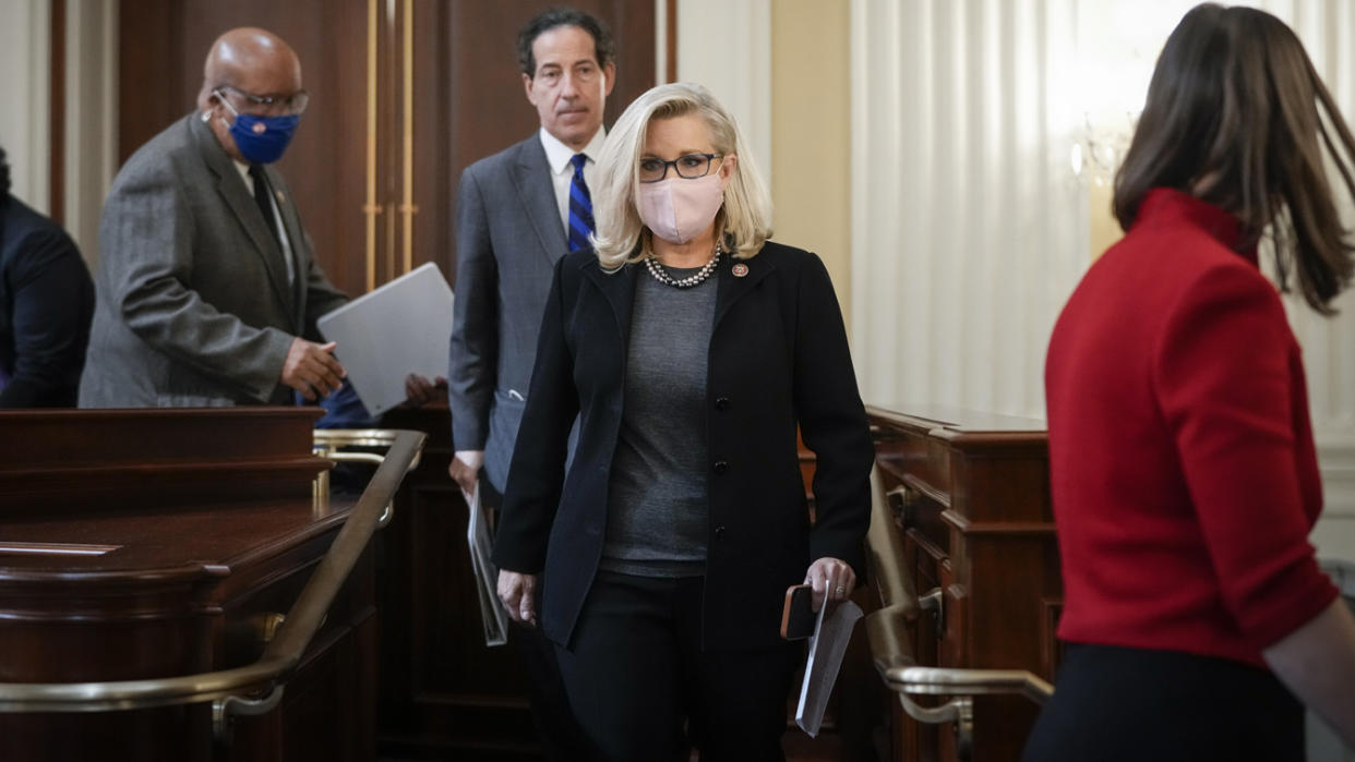 Rep. Liz Cheney wears a face mask as she departs a committee meeting on Capitol Hill.