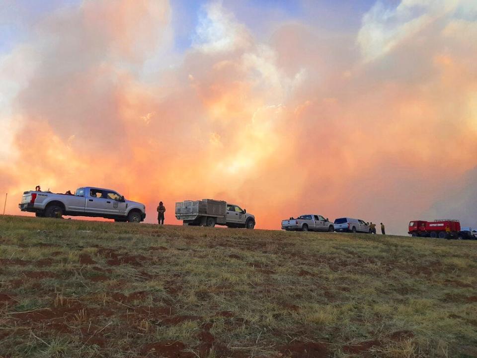 In this Sunday, May 1, 2022 photo provided by Jasper Bivens of Grayback Forestry, plumes of smoke from wildfires are seen from Highway 518, a few miles north of Las Vegas, N.M. New Mexico was in the bull's eye for the nation's latest wave of hot, dry and windy weather.