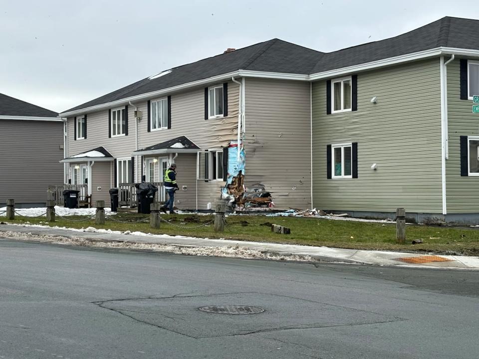 The single-vehicle crash that damaged this home in St. John's late last year left one man dead and two people in critical condition. (Sarah Blackmore/CBC - image credit)