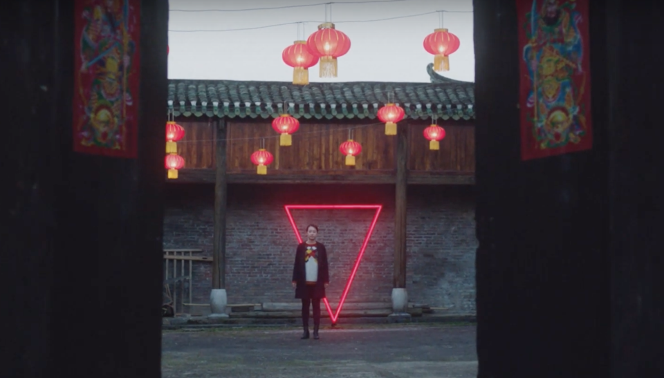 A woman waits to meet her parents at a halfway point between her parents’ home and her new city in SK-II’s <em>Meet Me Halfway</em> documentary. (Image: Courtesy of SK-II)