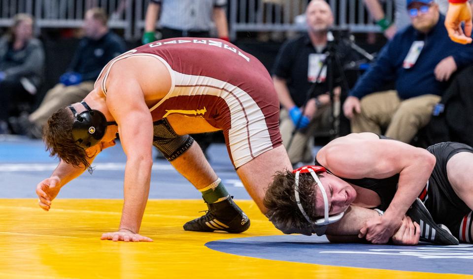 Mishawaka High School senior Christian Chavez wrestles in a 195-pound match against Center Grove High School junior Kaden McConnell during a quarter-final round of the IHSAA Wrestling State Championship, Friday, Feb. 17, 2023, at Gainbridge Fieldhouse in Indianapolis.