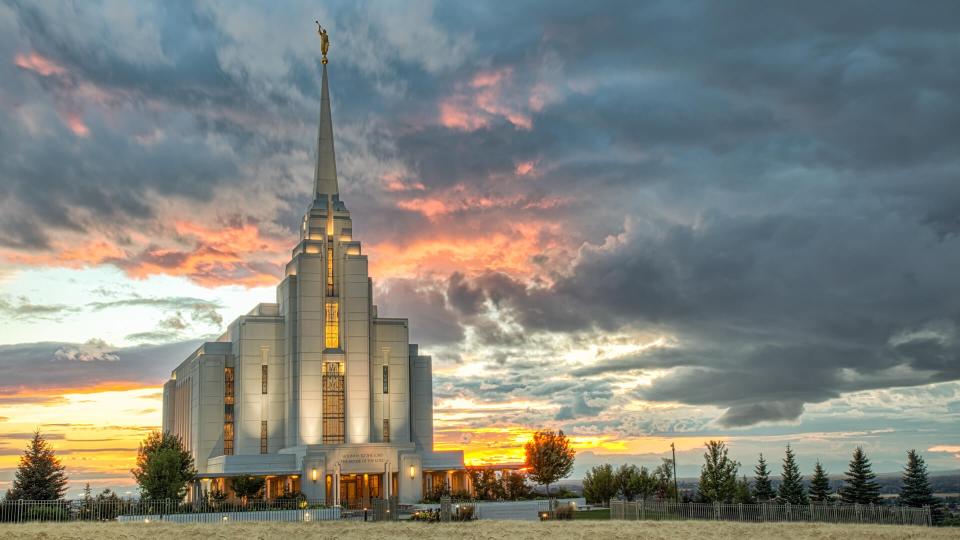 Wheat fields are almost ready to harvest near the Rexburg Idaho Temple at sunset.