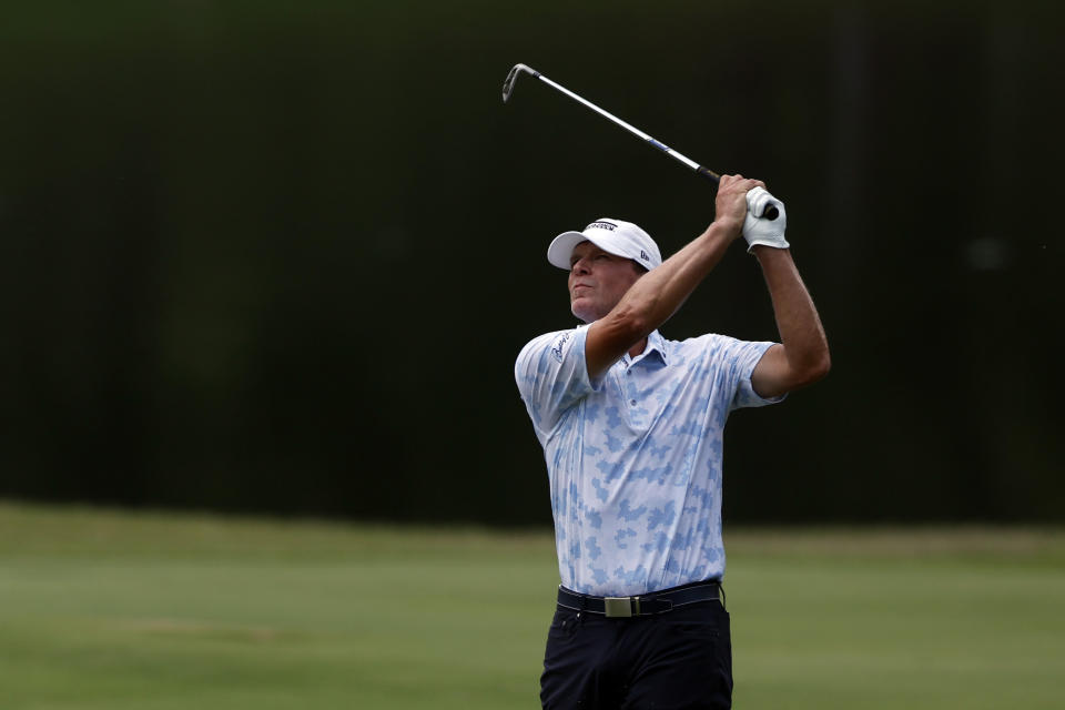 Steve Stricker hits an approach shot to the ninth green during the final round of a Champions Tour golf tournament, Sunday, May 14, 2023, in Hoover, Ala. (AP Photo/Butch Dill)