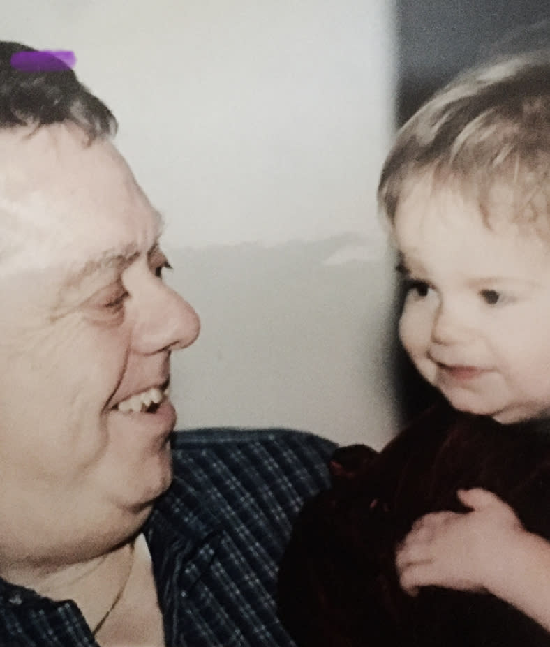 Daniel holding one of his granddaughters. 