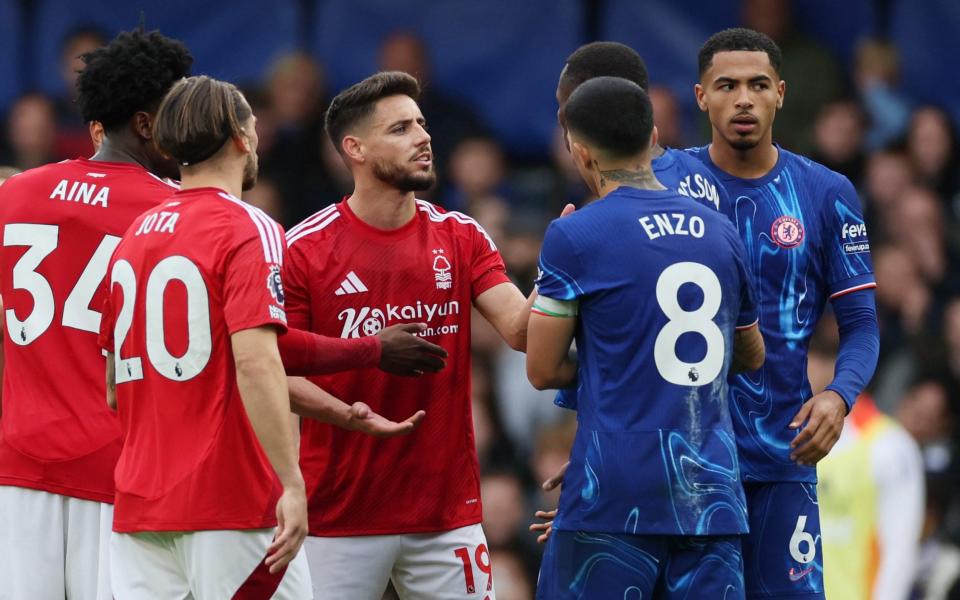 Nottingham Forest's Alex Moreno clashes with Chelsea's Nicolas Jackson