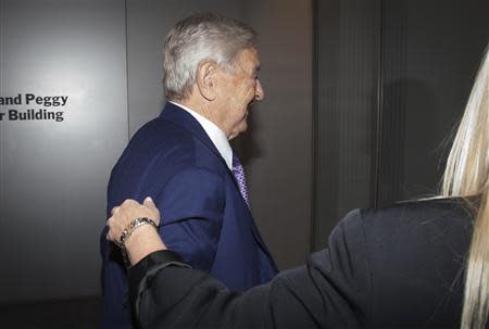 Billionaire George Soros arrives at the Museum of Modern Art in New York, September 20, 2013. REUTERS/Carlo Allegri