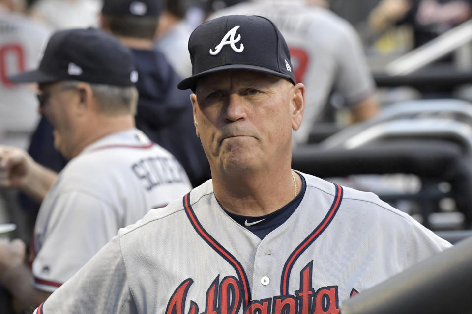FILE - In this Friday, Aug. 3, 2018 file photo, Atlanta Braves manager Brian Snitker looks on from the dugout before a baseball game against the New York Mets in New York. Atlanta's Brian Snitker has been voted National League Manager of the Year after leading the Braves to a surprising first-place finish. Snitker received 17 first-place votes, nine seconds and one third for 116 points from the Baseball Writers' Association of America in balloting announced Tuesday, Nov. 13, 2018.(AP Photo/Bill Kostroun, File)