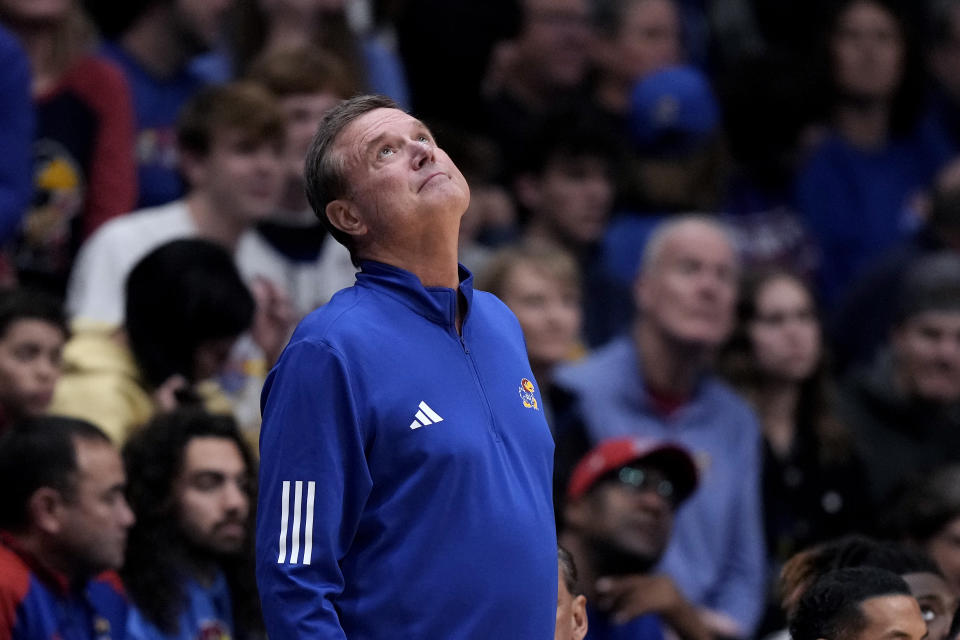Kansas head coach Bill Self looks at the scoreboard during the second half of an NCAA college basketball game against Eastern Illinois Tuesday, Nov. 28, 2023, in Lawrence, Kan. Kansas won 71-63. (AP Photo/Charlie Riedel)