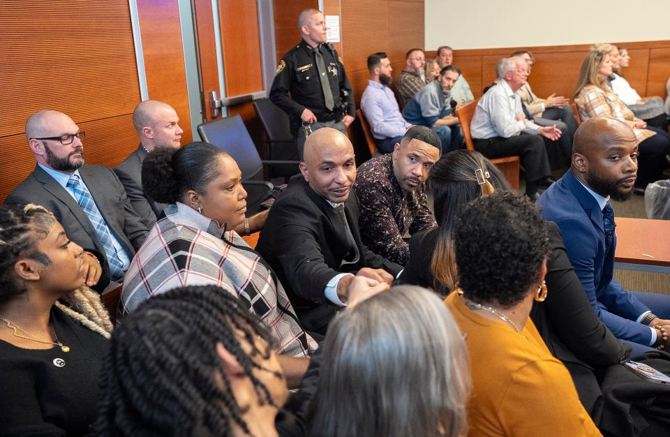 Feb 1, 2024; Columbus, Ohio, USA; Ernest Payne Jr., the uncle of Goodson, is greeted by friends and family after he testified during the trial of Franklin County Sheriff's office deputy Jason Meade at the Franklin County Common Pleas Court.