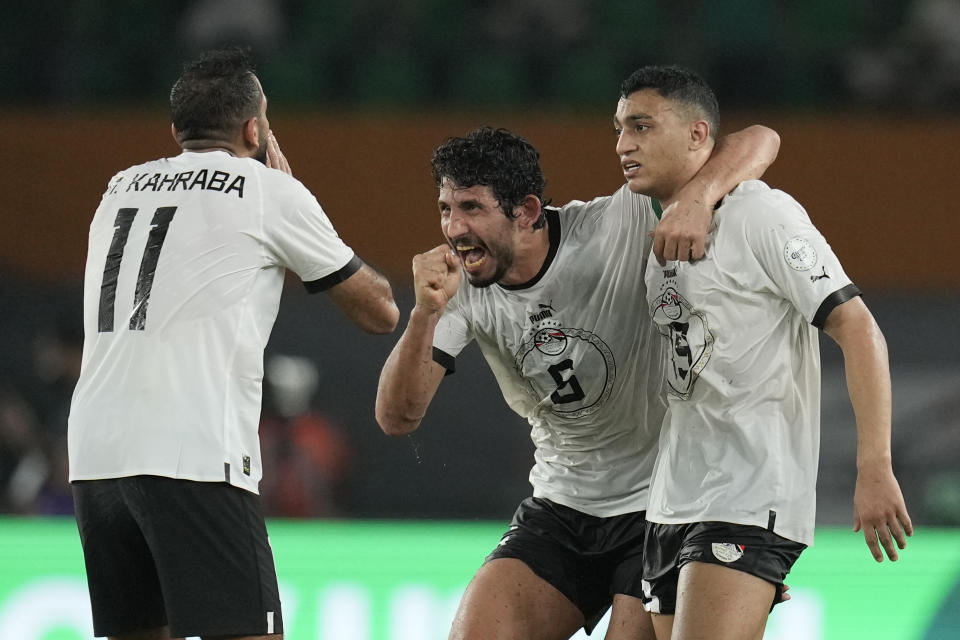 Egypt players celebrate after Mostafa Mohamed scored his side's second goal during the African Cup of Nations Group B soccer match between Cape Verde and Egypt at the Felix Houphouet Boigny stadium in Abidjan, Ivory Coast, Monday, Jan. 22, 2024. (AP Photo/Themba Hadebe)