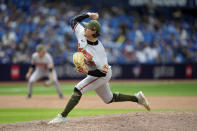 Baltimore Orioles relief pitcher Mike Baumann (53) pitches to the Toronto Blue Jays during the 11th inning of a baseball game in Toronto, Sunday, May 21, 2023. (Frank Gunn/The Canadian Press via AP)