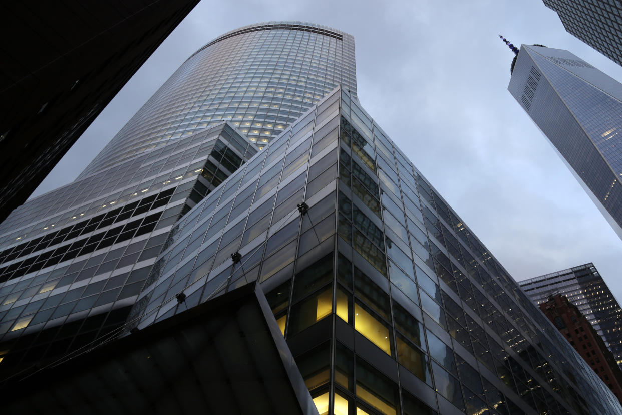 Lights are on at the world headquarters of Goldman Sachs in New York on Tuesday, Jan. 24, 2023. The storied investment bank has recently signaled a partial retreat from its efforts to build up a consumer banking business. The World Trade Center is at right. (AP Photo/Peter Morgan)