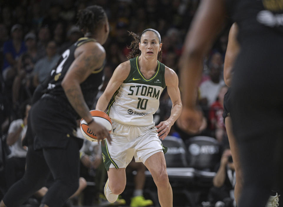 Seattle Storm guard Sue Bird (10) defends Las Vegas Aces guard Riquna Williams (2) during the second half of a WNBA basketball game, Sunday, Aug. 14, 2022, in Las Vegas. (AP Photo/Sam Morris)