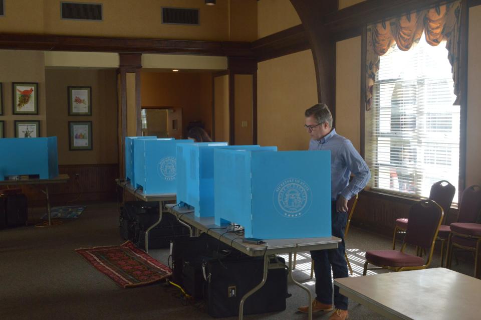 A voter casts their ballot inside the First Presbyterian Church polling location for the general primary election on May 21, 2024.