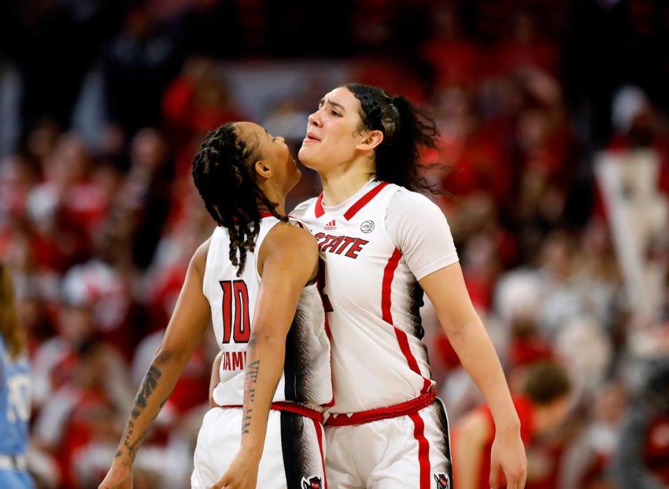N.C. State’s Aziaha James and Mimi Collins celebrate after James drew an offensive foul during the second half of the Wolfpack’s 63-59 win over North Carolina on Thursday, Feb. 1, 2024, at Reynolds Coliseum in Raleigh, N.C. Kaitlin McKeown/kmckeown@newsobserver.com