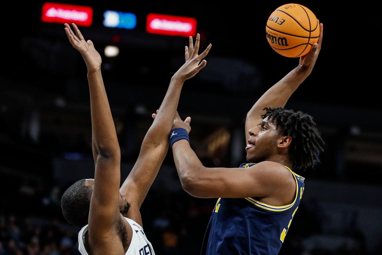 Michigan forward Tarris Reed Jr. (32) shoots the basketball against Penn State forward Demetrius Lilley (14) during the first half of the First Round of Big Ten tournament at Target Center in Minneapolis, Minn. on Wednesday, March 13, 2024.