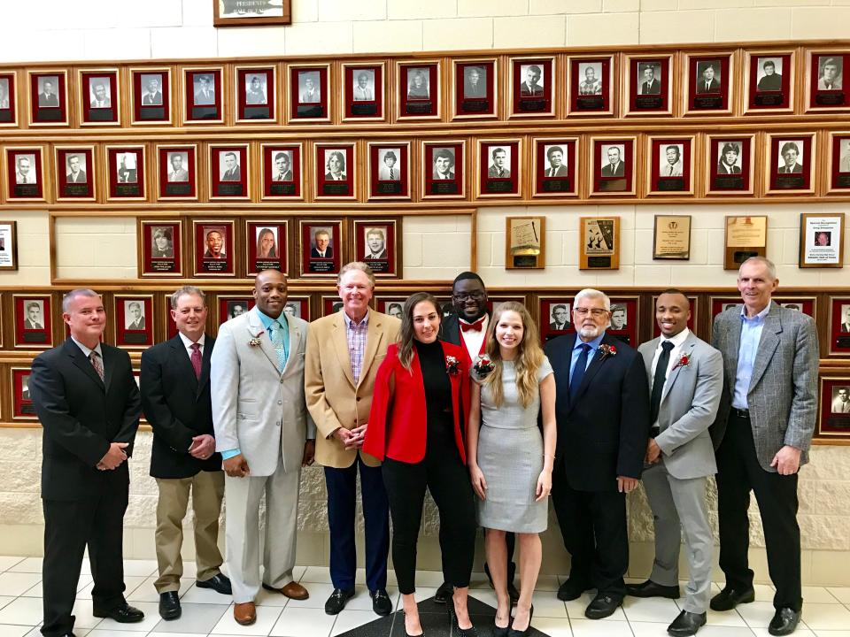 Representing the 29th class of the Marion Harding High School Athletic Hall of Fame for 2019 are from left: Chris Rock and Matt Rock accepting for their late father Matt Rock, Dominic Ross, Al Rowley of the 1963 basketball team, Jessica Jenkins, Thaddeaus Carter, Dr. Taylor McCurdy White, Ed Henning, Da'Vell Winters and Russ Hamilton of the 1963 basketball team. This was the last set of inductees into the hall as a new class is slated to be enshrined in April of 2023. The committee is taking nominees to be considered this fall.