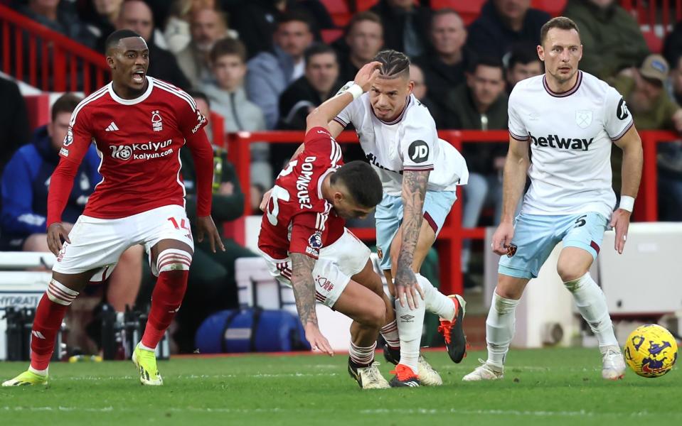 West Ham United's Kalvin Phillips pushes over Nottingham Forest's Nicolas Dominguez to earn a yellow card