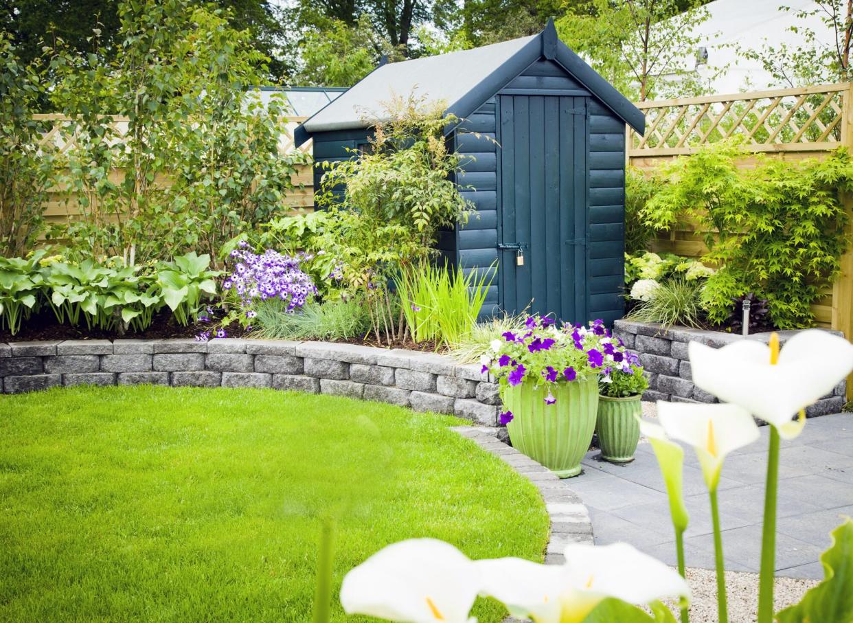 Garden shed in a beautiful green garden