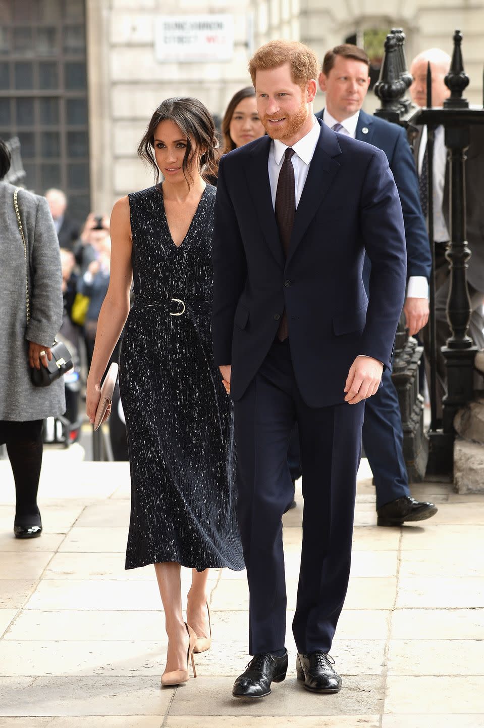 <p>And now check out Meg’s Hugo Boss dress, which she wore to a memorial service in London in 2018. Similar, no?</p>