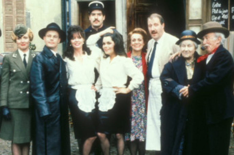 <p>The cast of ‘Allo ‘Allo gather outside Cafe René. (BBC Archives) </p>