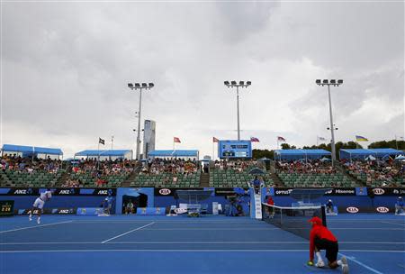 Tommy Robredo of Spain serves to Julien Benneteau (not pictured) of France during their men's singles match at the Australian Open 2014 tennis tournament in Melbourne January 15, 2014. REUTERS/Petar Kujundzic